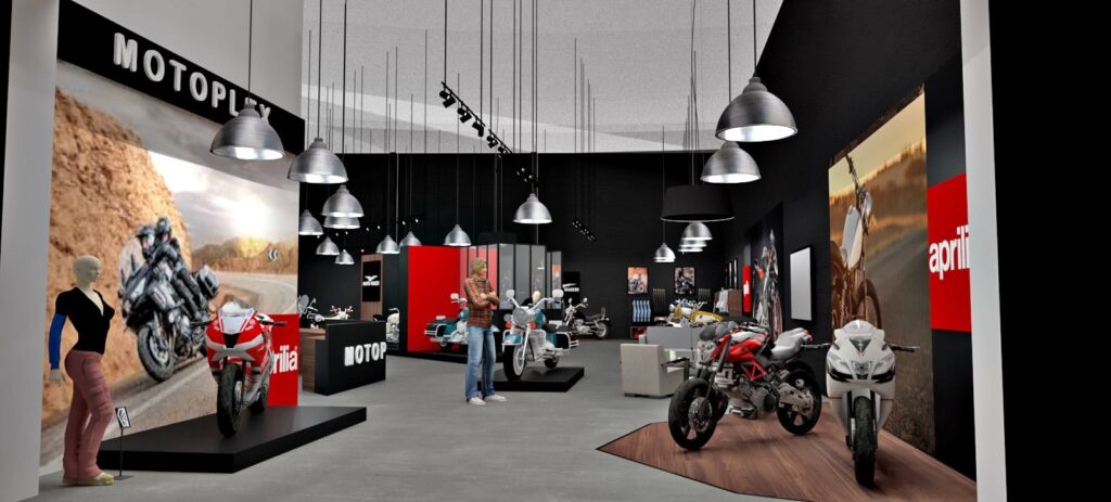 Salle d'exposition de motos moderne avec plusieurs motos exposées, de grandes affiches sur les murs, des projecteurs au-dessus de la tête et quelques personnes en train de parcourir les lieux.