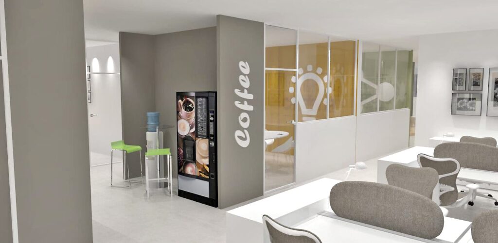 Espace de bureau moderne avec des bureaux, un distributeur de café, un distributeur d'eau et des tabourets de bar verts près d'une salle de réunion vitrée avec un motif d'ampoule sur le mur.