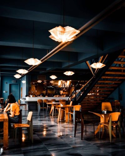 people sitting on chairs inside restaurant