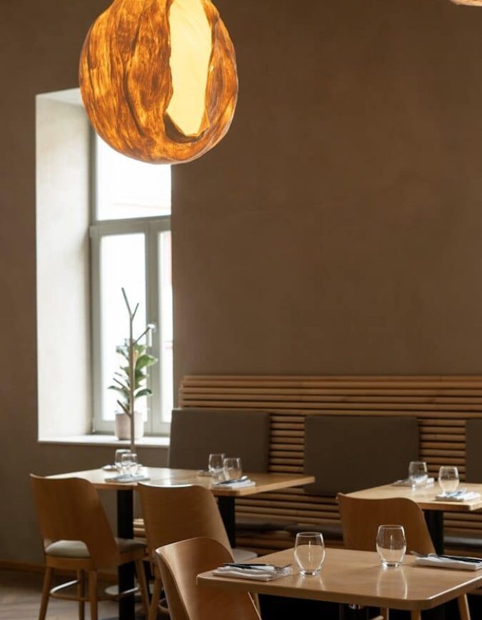a restaurant with wooden tables and chairs