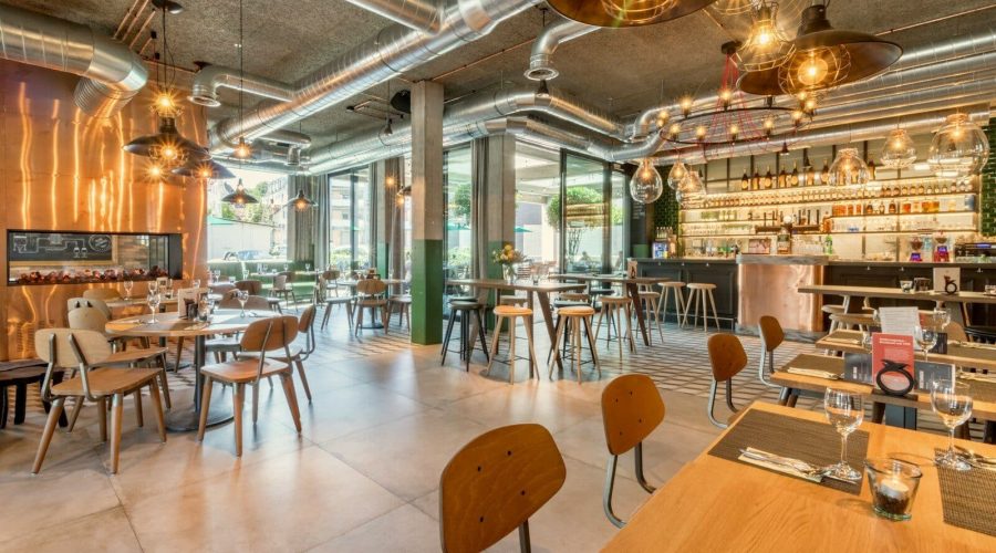 brown wooden tables and chairs inside building